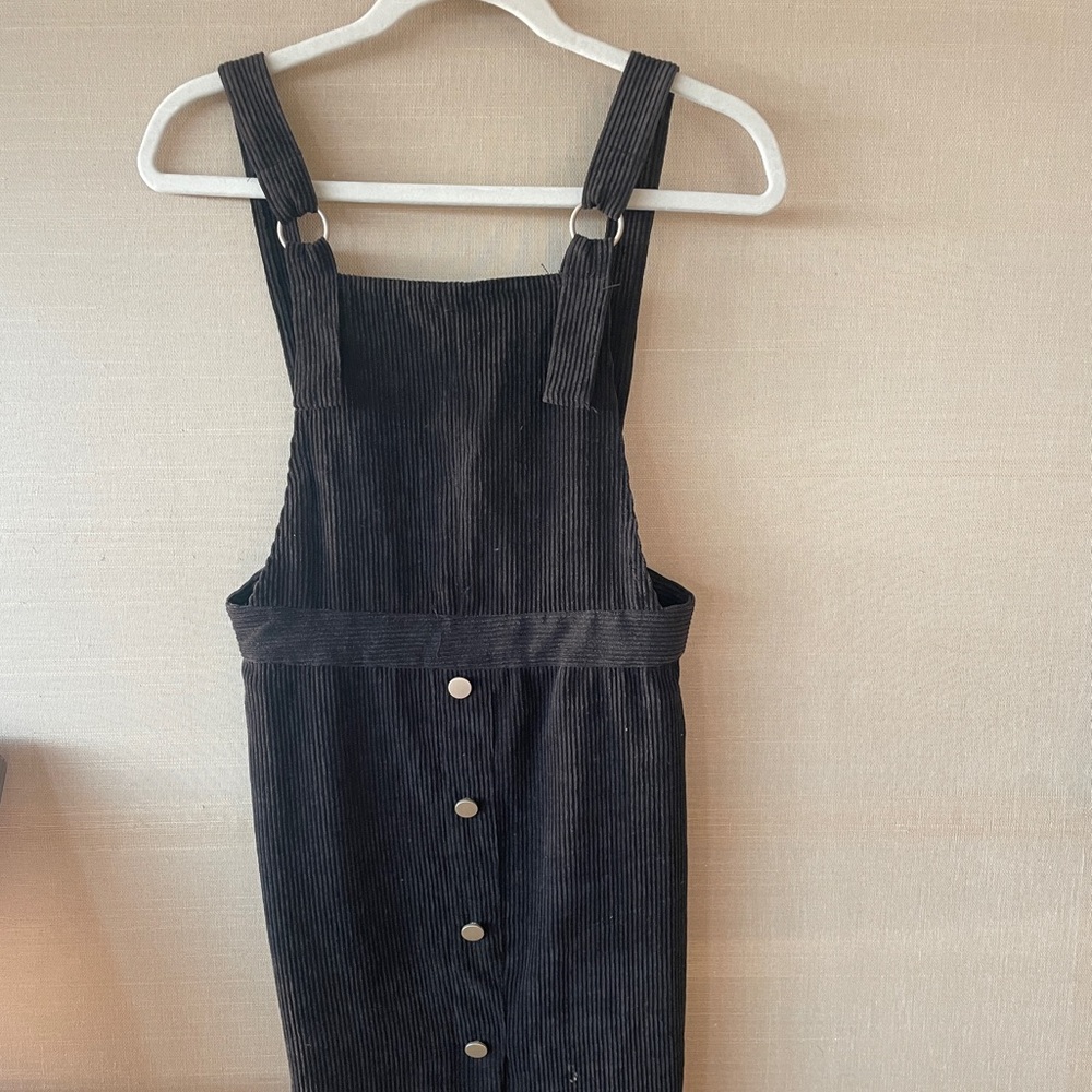 Corduroy dress with gold bottons down the center.
